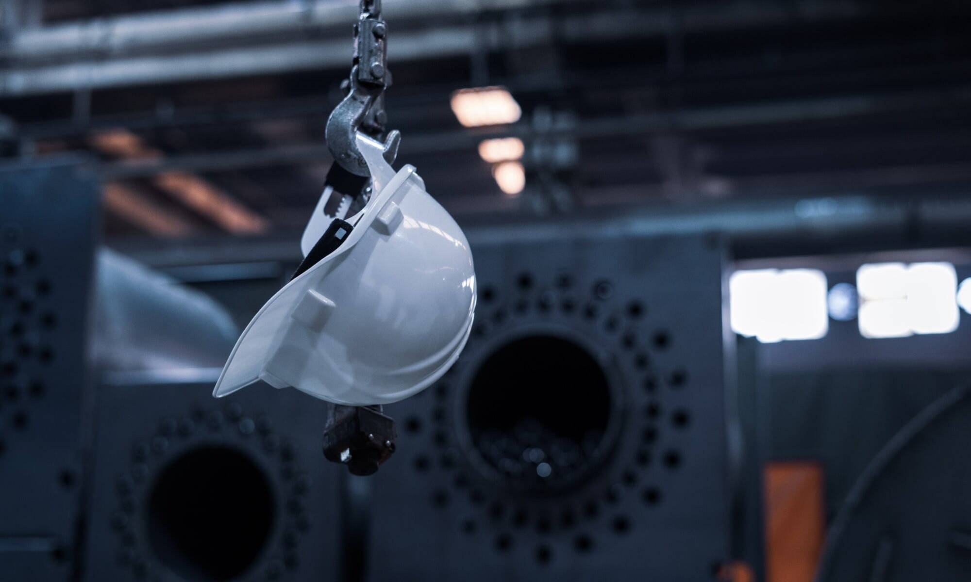 Hard hat balancing off a crane 